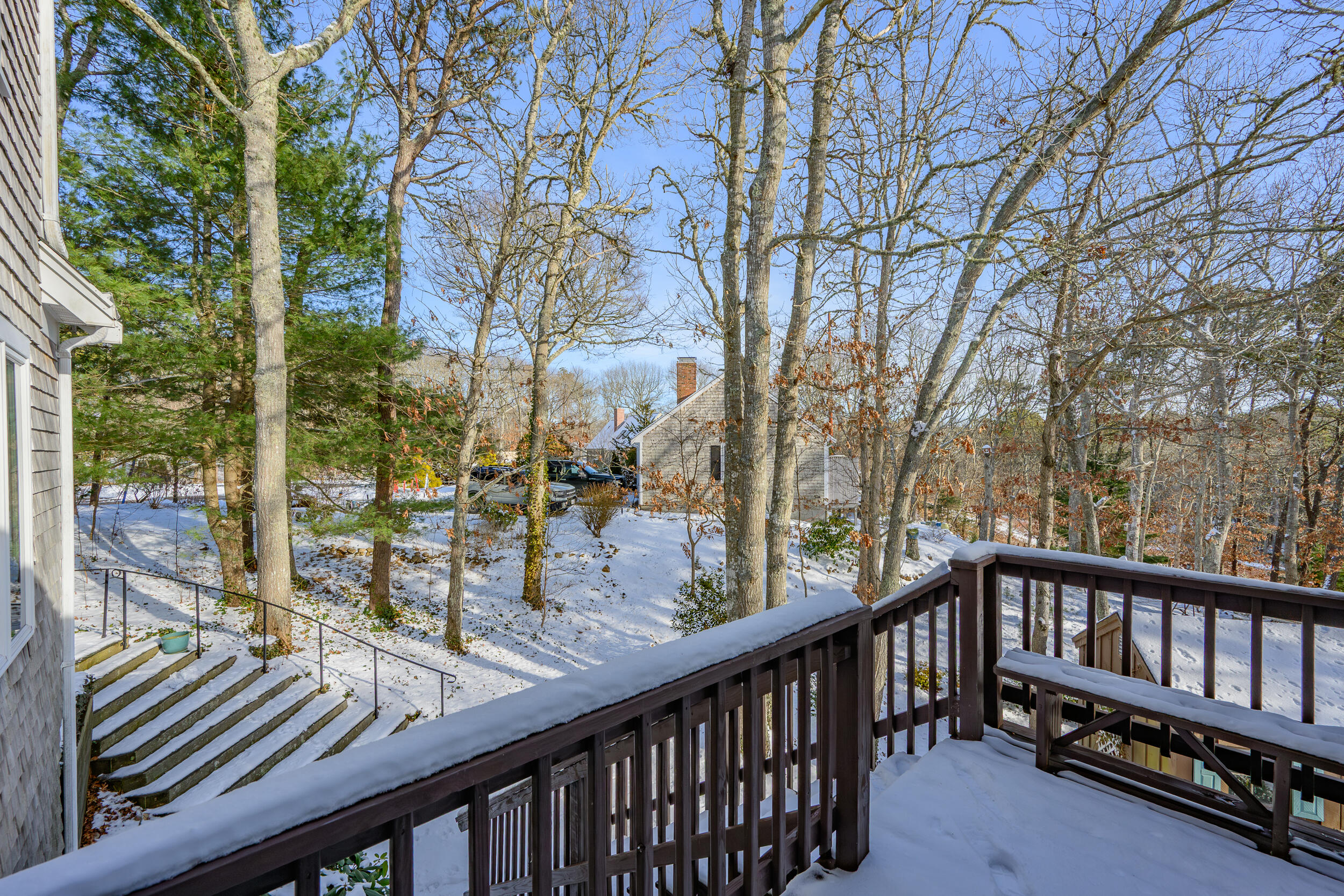 36 Island Street East Dennis, MA 02660 - Photo 35 of 41 a view of a balcony with wooden chairs and floor and wooden fence