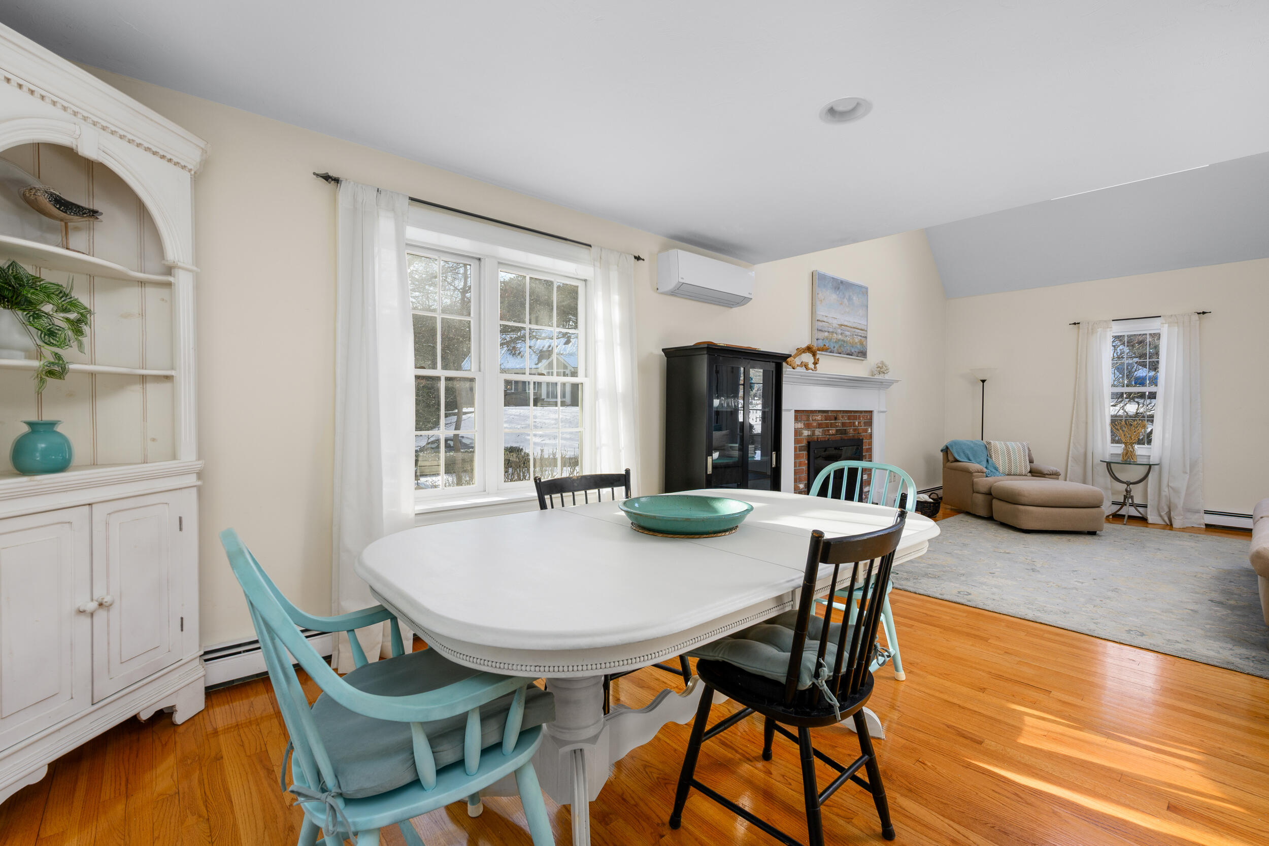 36 Island Street East Dennis, MA 02660 - Photo 7 of 41 a view of a dining room with furniture and wooden floor