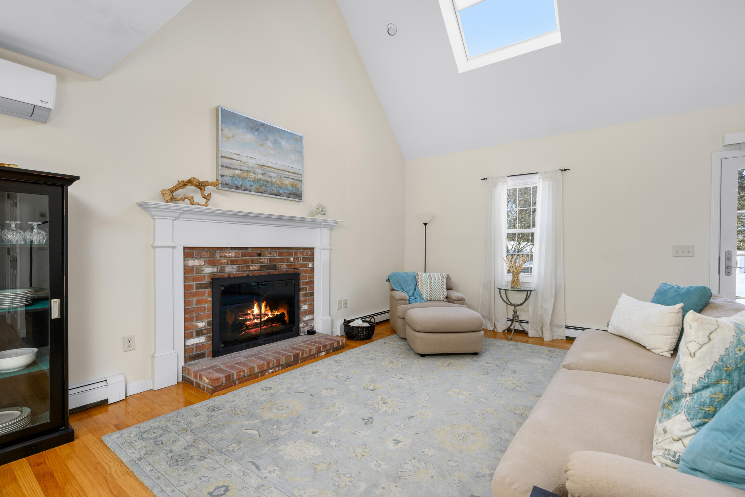 36 Island Street East Dennis, MA 02660 - Photo 8 of 41 a living room with furniture and a fireplace