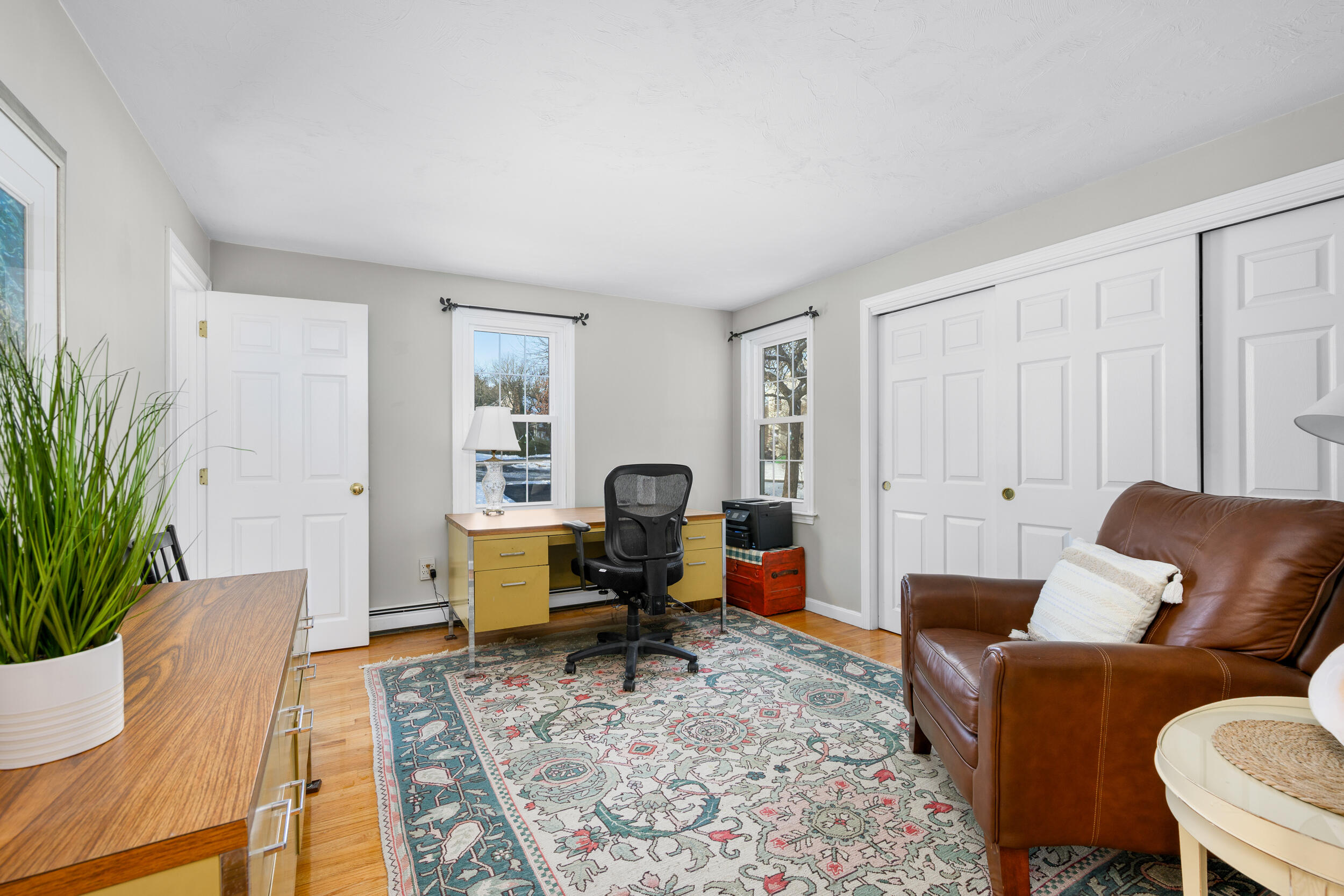 36 Island Street East Dennis, MA 02660 - Photo 10 of 41 a living room with furniture chairs and a potted plant