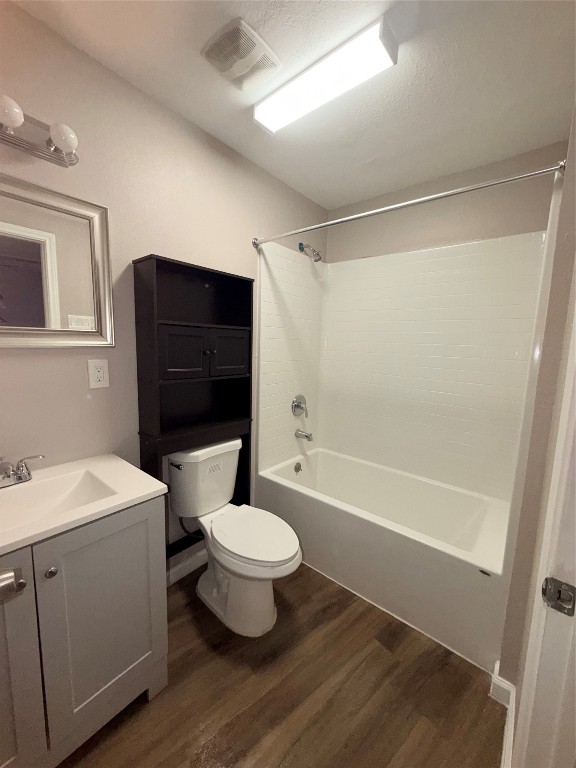 13217 Player Street, Unit B Houston, TX 77045 - Photo 11 of 22 a bathroom with a sink toilet a mirror and shower
