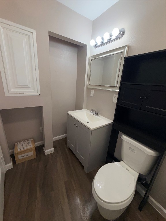 13217 Player Street, Unit B Houston, TX 77045 - Photo 12 of 22 a bathroom with a toilet sink and mirror