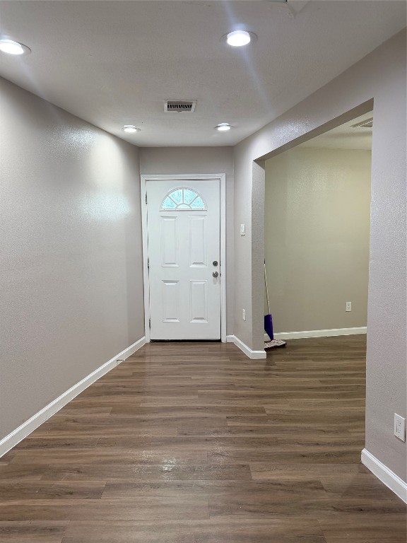 13217 Player Street, Unit B Houston, TX 77045 - Photo 18 of 22 a view of an empty room with wooden floor
