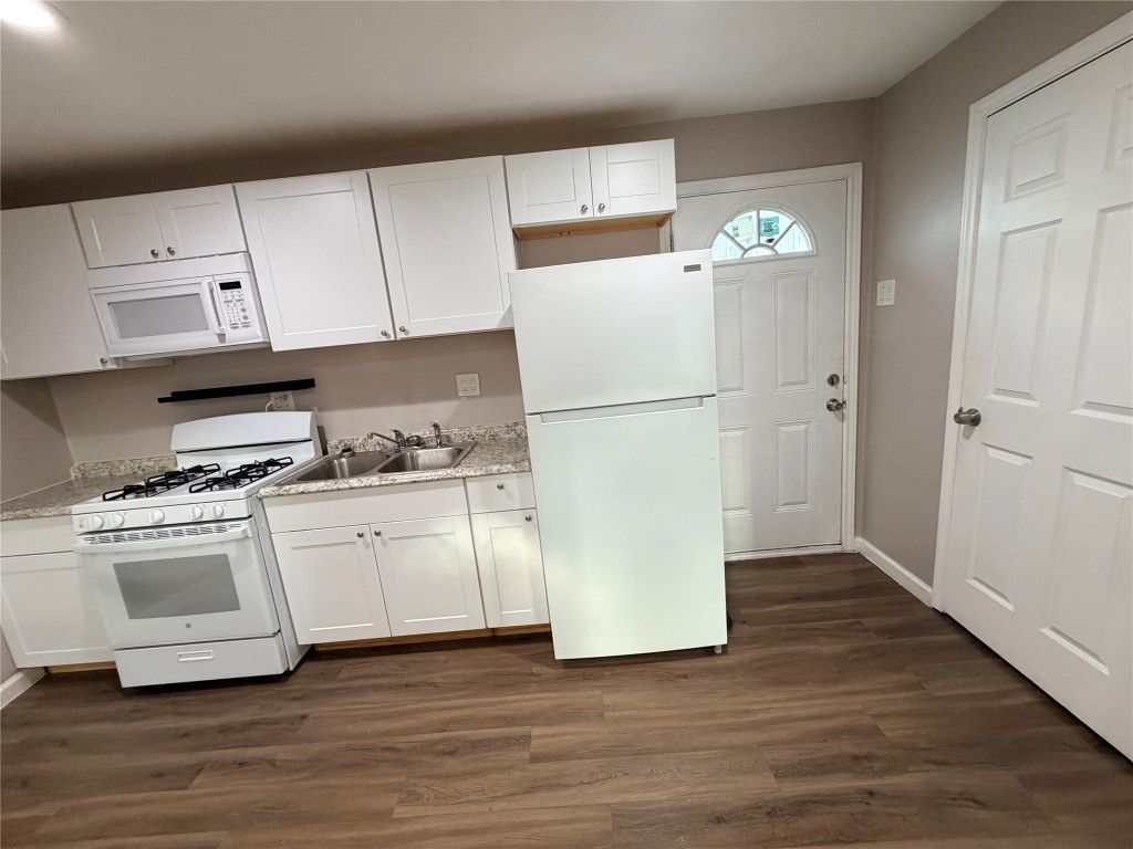 13217 Player Street, Unit B Houston, TX 77045 - Photo 21 of 22 a white refrigerator freezer sitting in a kitchen