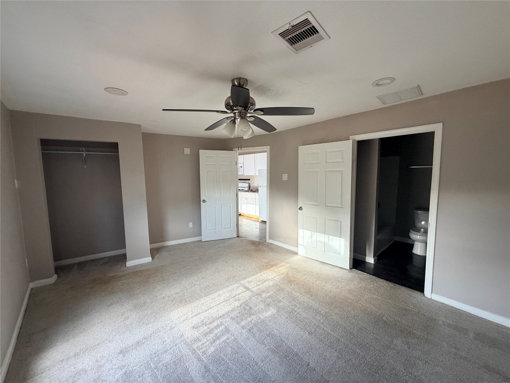 13217 Player Street, Unit B Houston, TX 77045 - Photo 8 of 22 a view of empty room with ceiling fan