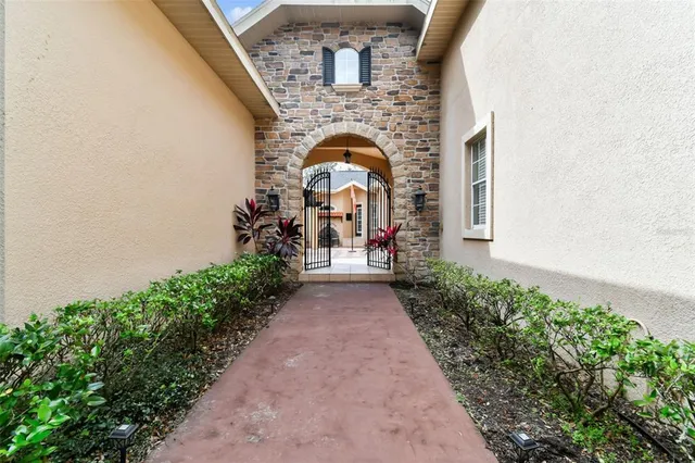 a view of a patio with a table and chairs under an umbrella with a patio