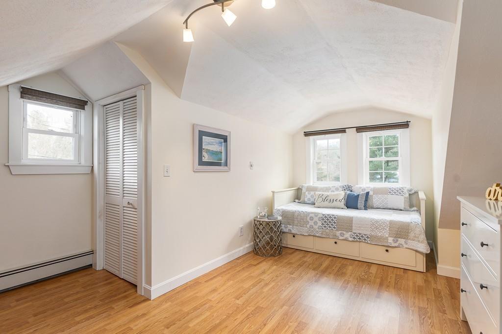 24 Wheeler Road Bolton, MA 01740 - Photo 12 of 28 a living room with furniture and a window