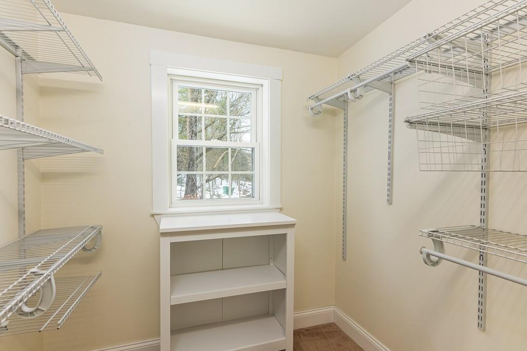 24 Wheeler Road Bolton, MA 01740 - Photo 18 of 28 a bathroom with a sink and a mirror