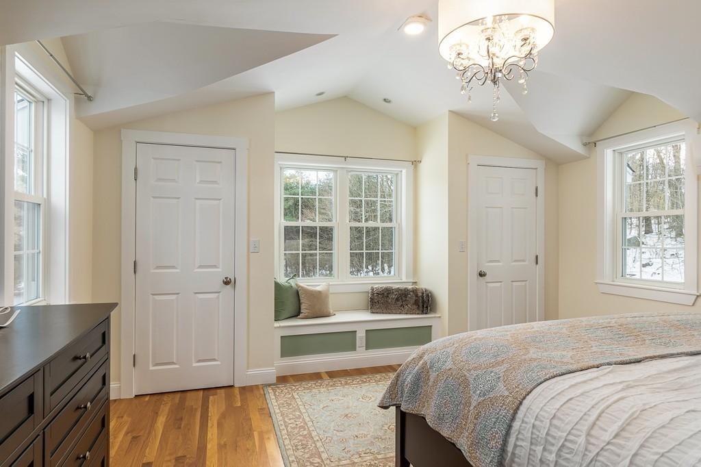 24 Wheeler Road Bolton, MA 01740 - Photo 21 of 28 a spacious bedroom with a bed and a window