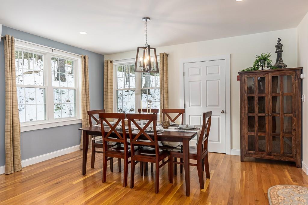 24 Wheeler Road Bolton, MA 01740 - Photo 5 of 28 a view of a dining room with furniture window and wooden floor