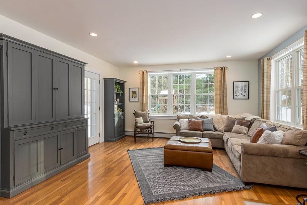 24 Wheeler Road Bolton, MA 01740 - Photo 7 of 28 a living room with furniture and a large window