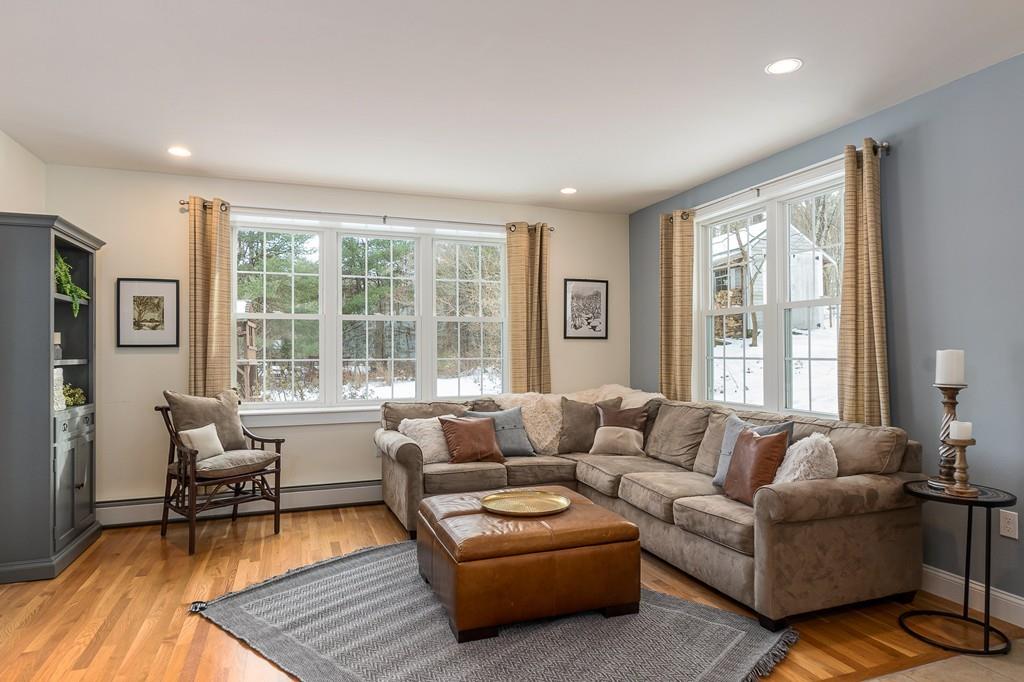 24 Wheeler Road Bolton, MA 01740 - Photo 8 of 28 a living room with furniture and a large window