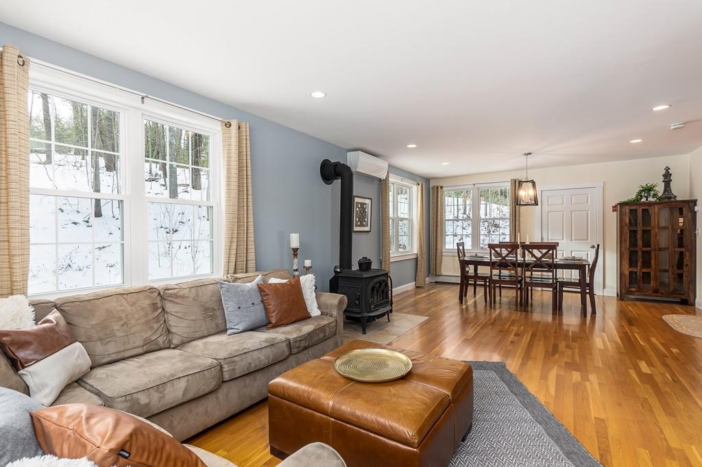 24 Wheeler Road Bolton, MA 01740 - Photo 9 of 28 a living room with furniture and a large window