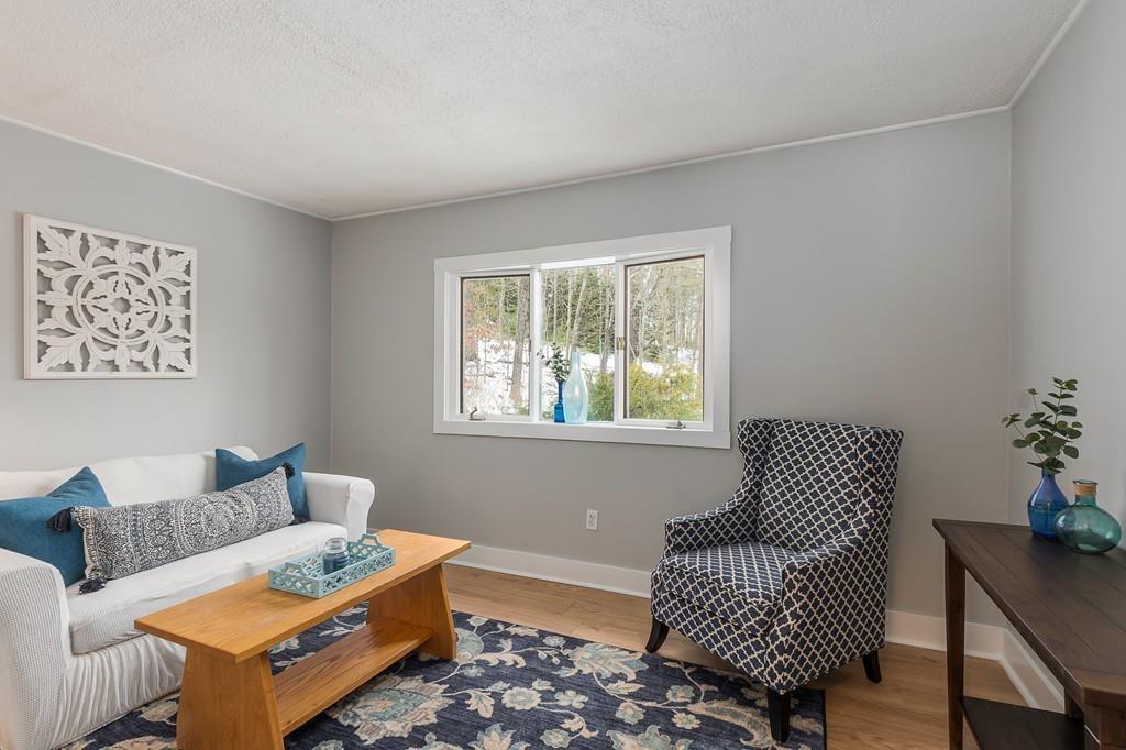 24 Wheeler Road Bolton, MA 01740 - Photo 10 of 28 a living room with furniture and a window