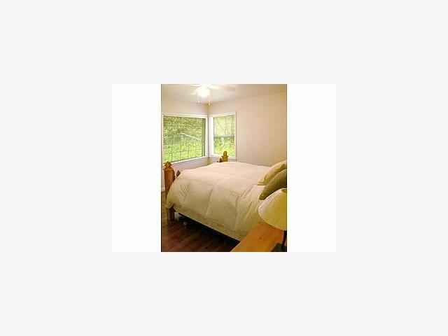 3500 North Rodeo Gulch Road Soquel, CA 95073 - Photo 7 of 9 a bedroom with a bed and a night stand