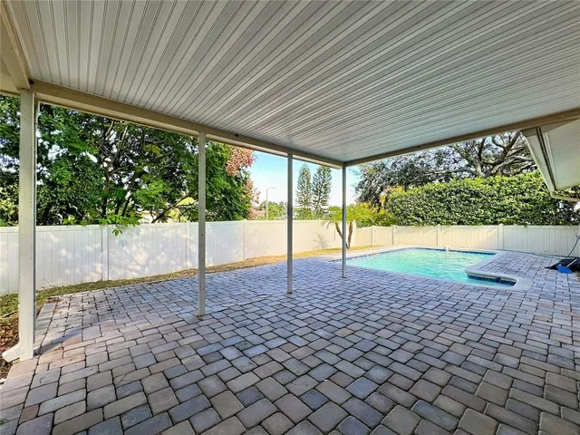 a view of a backyard with sitting area