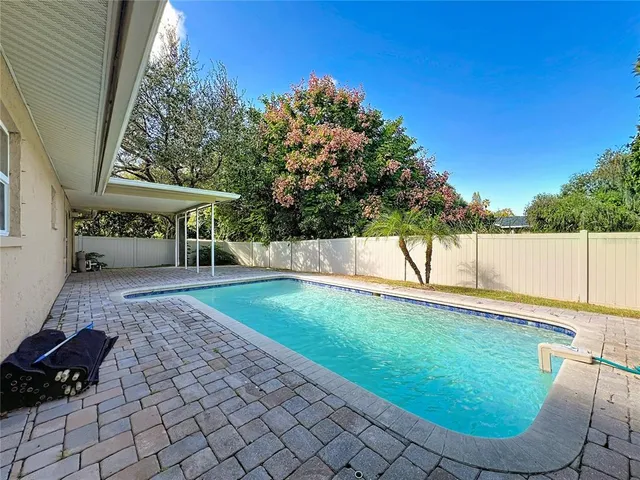 a house view with a backyard space