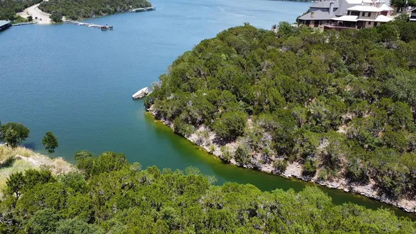 a view of a lake with a yard
