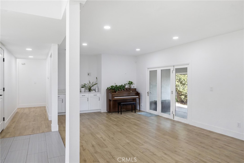 384 Colorado Street Arcadia, CA 91007 - Photo 29 of 51 a room with furniture and a wooden floor