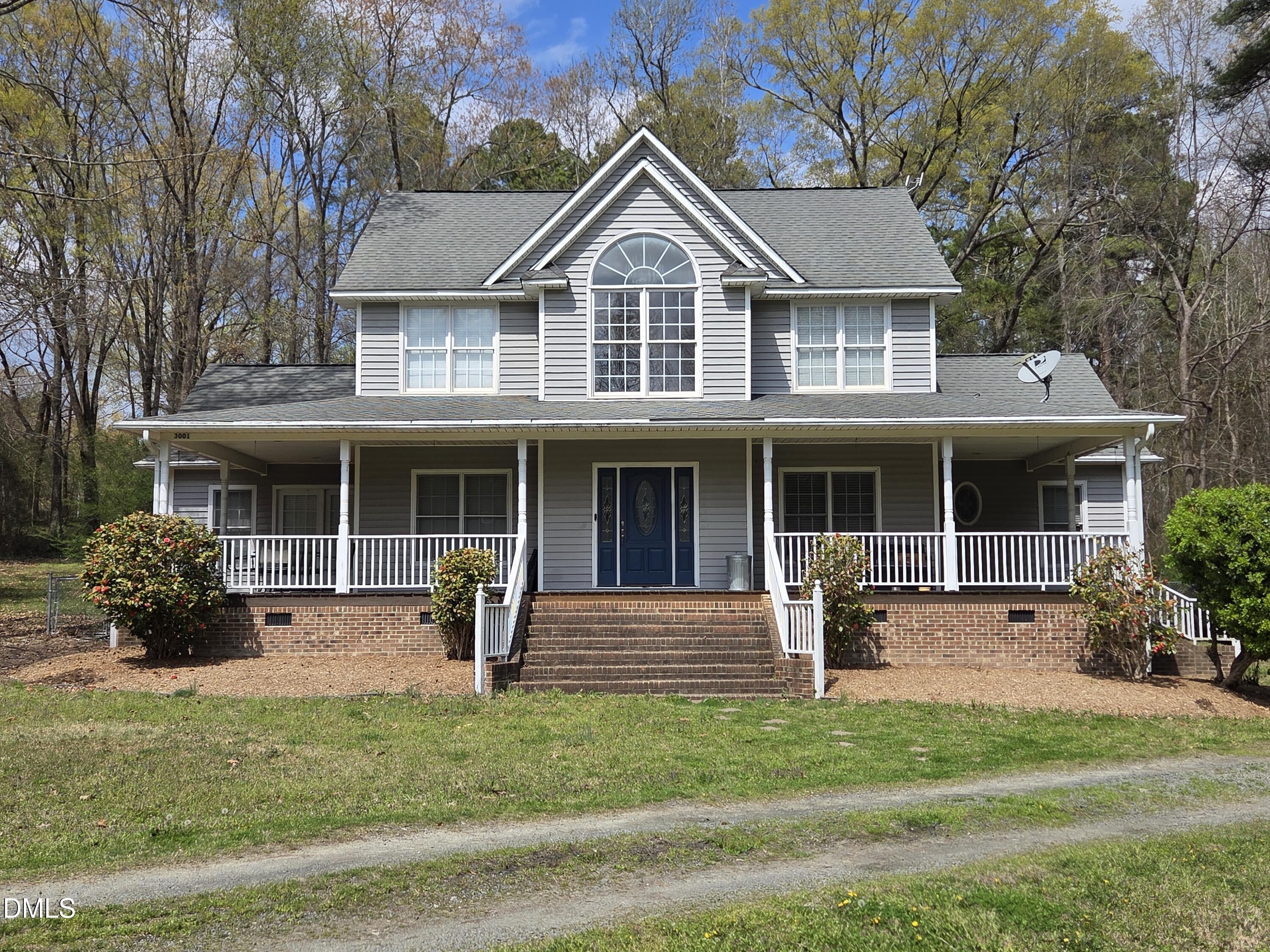 3001 Hidden Spring Lane Oxford, NC 27565 - Photo 1 of 57 a front view of a house with garden