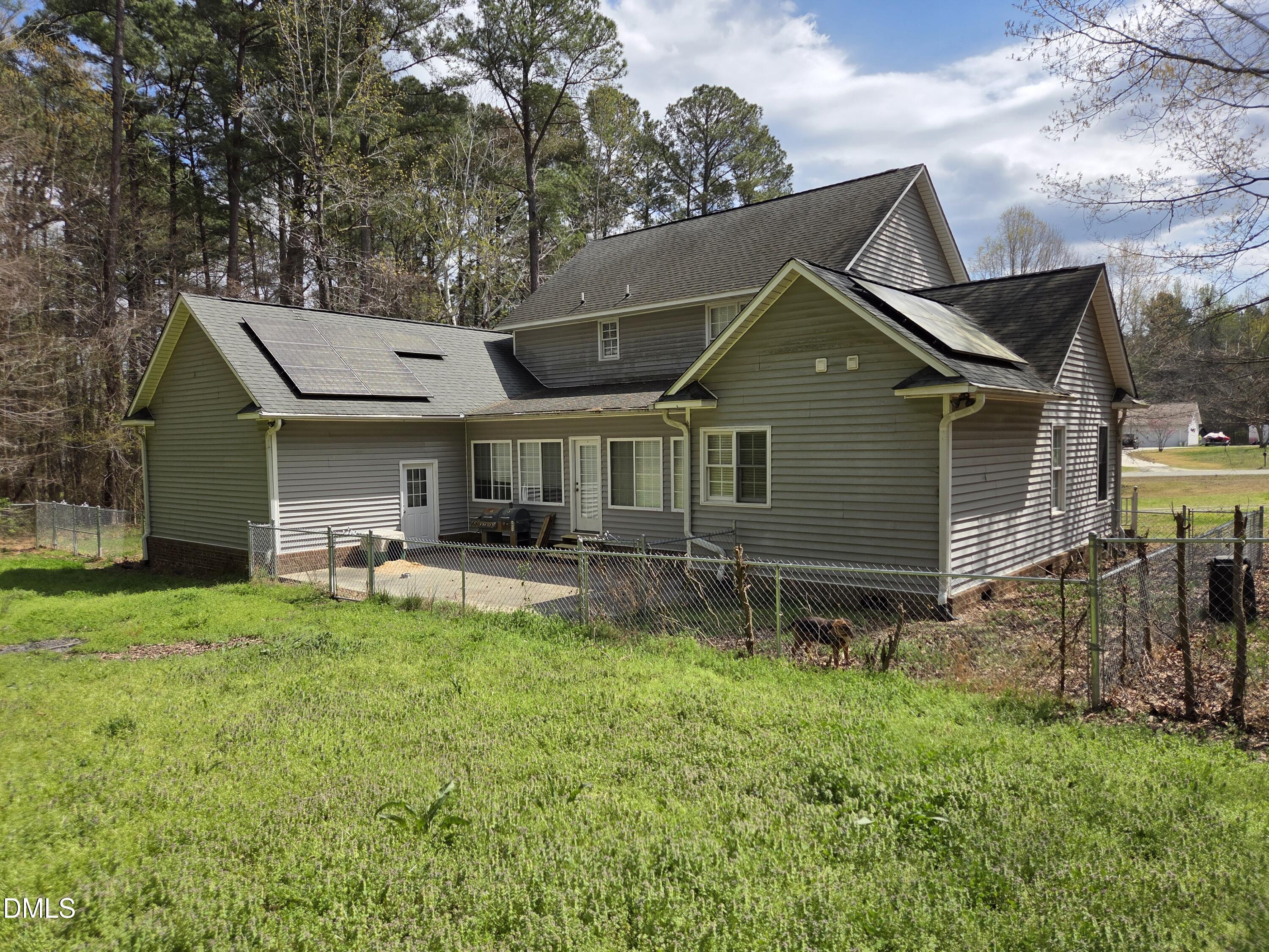 3001 Hidden Spring Lane Oxford, NC 27565 - Photo 12 of 57 a backyard of a house with table and chairs