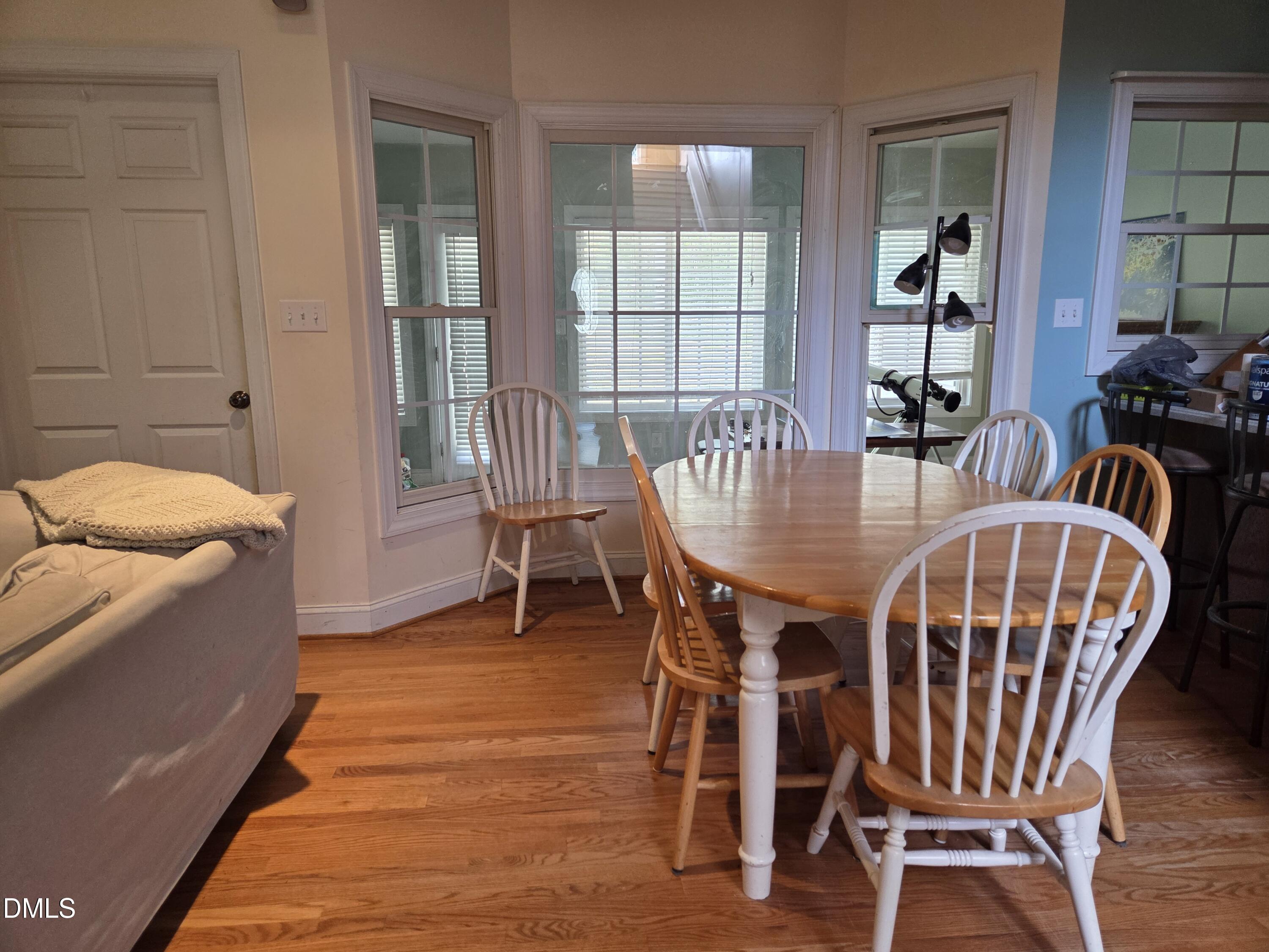 3001 Hidden Spring Lane Oxford, NC 27565 - Photo 18 of 57 a view of a dining room with furniture window and wooden floor