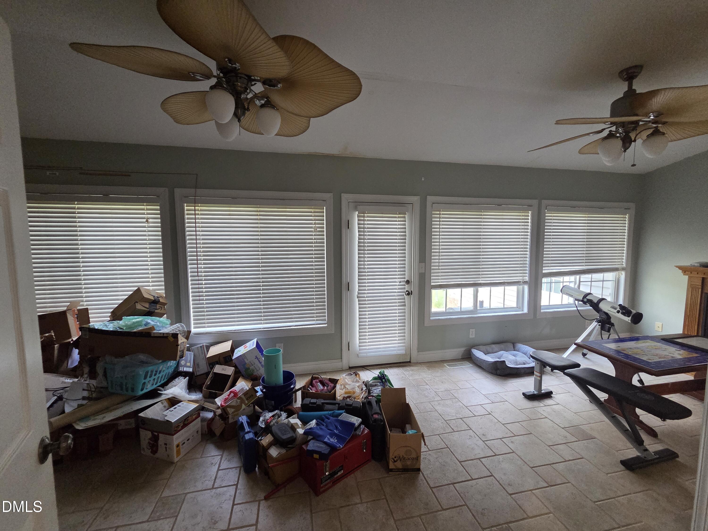3001 Hidden Spring Lane Oxford, NC 27565 - Photo 21 of 57 a living room with furniture a window and gym equipment