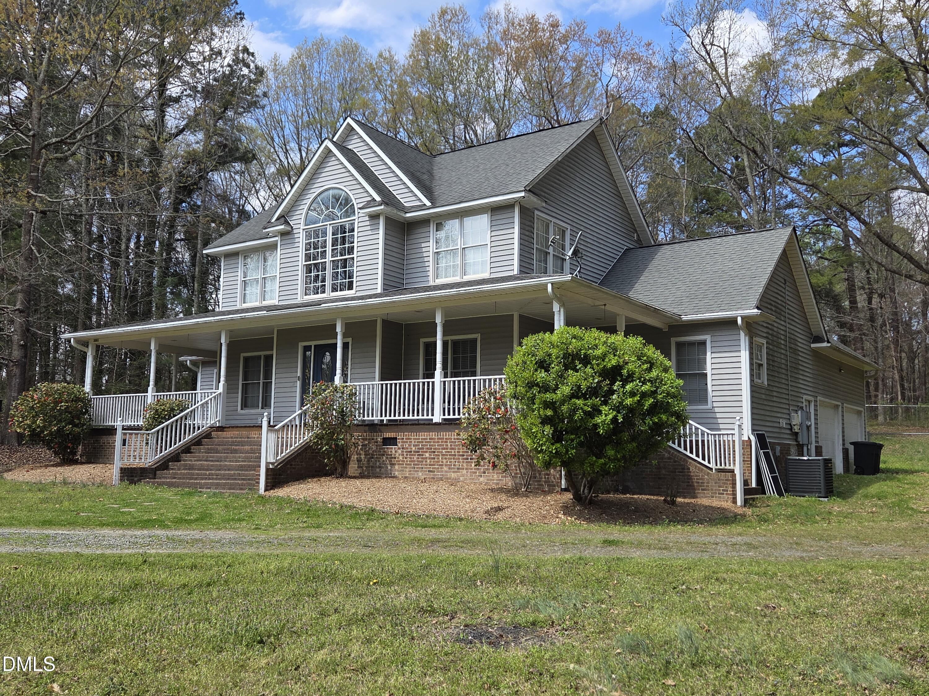 3001 Hidden Spring Lane Oxford, NC 27565 - Photo 3 of 57 a front view of a house with a garden and porch