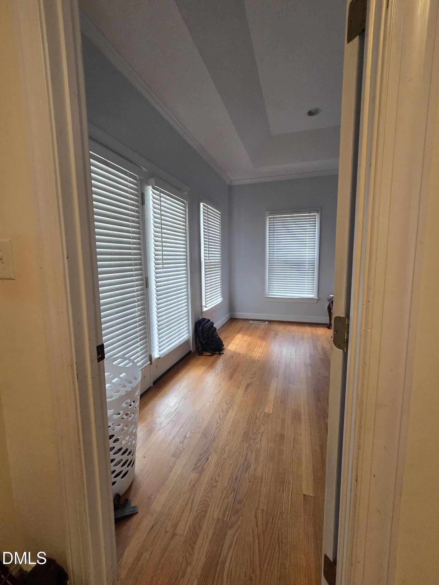 3001 Hidden Spring Lane Oxford, NC 27565 - Photo 35 of 57 a view of an empty room with wooden floor and a window