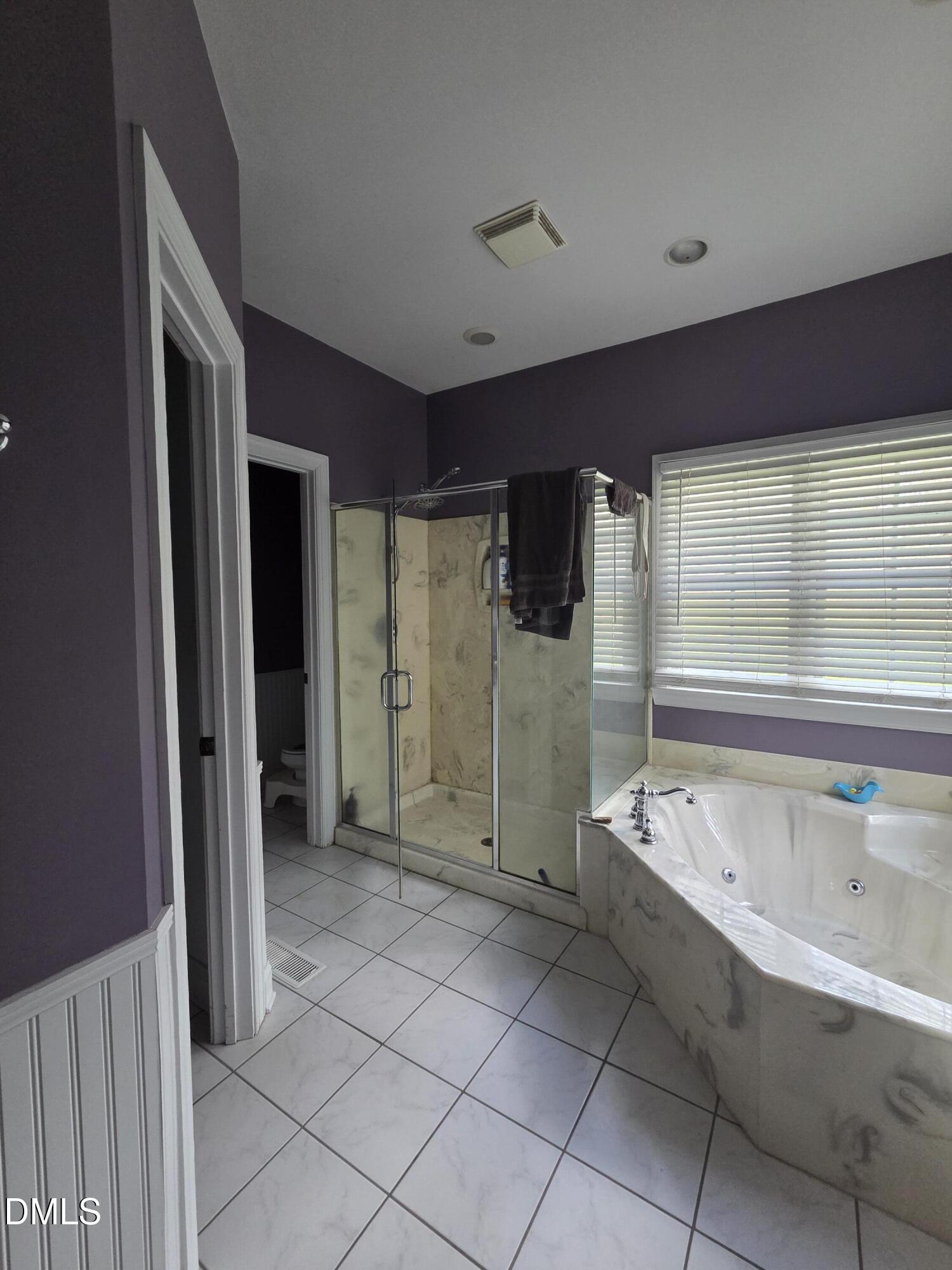 3001 Hidden Spring Lane Oxford, NC 27565 - Photo 43 of 57 a spacious bathroom with a bathtub and a shower