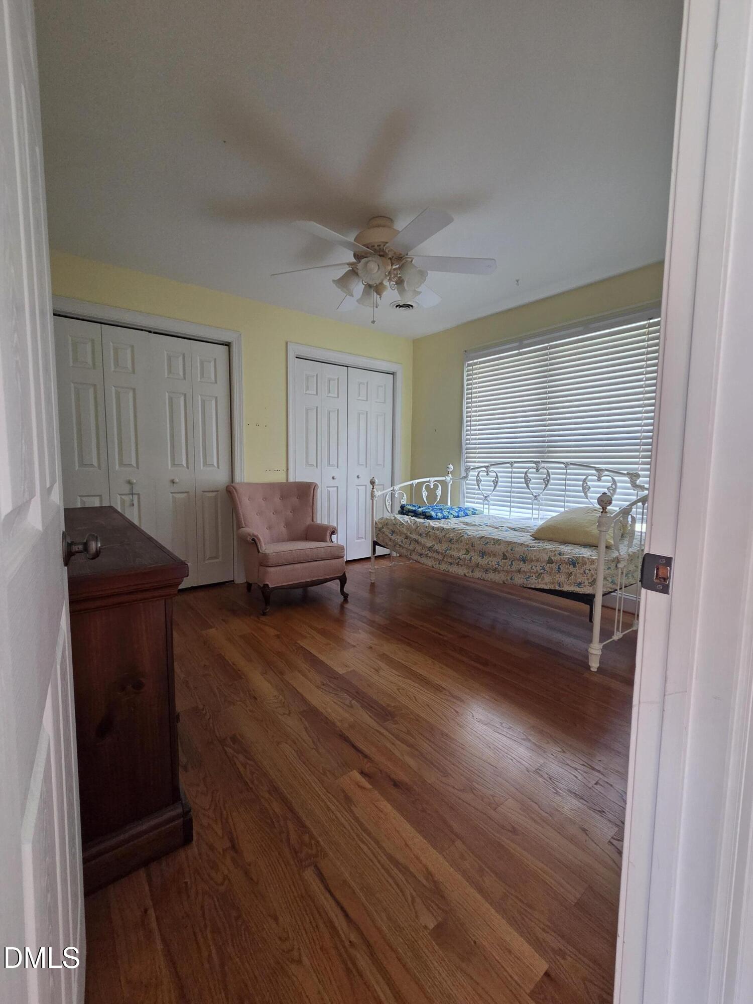 3001 Hidden Spring Lane Oxford, NC 27565 - Photo 52 of 57 a bedroom with a bed and wooden floor