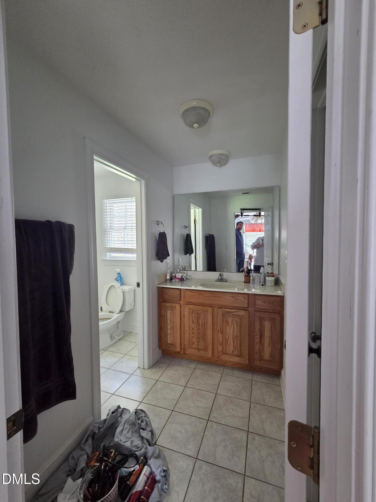 3001 Hidden Spring Lane Oxford, NC 27565 - Photo 57 of 57 a room with a refrigerator and a dresser