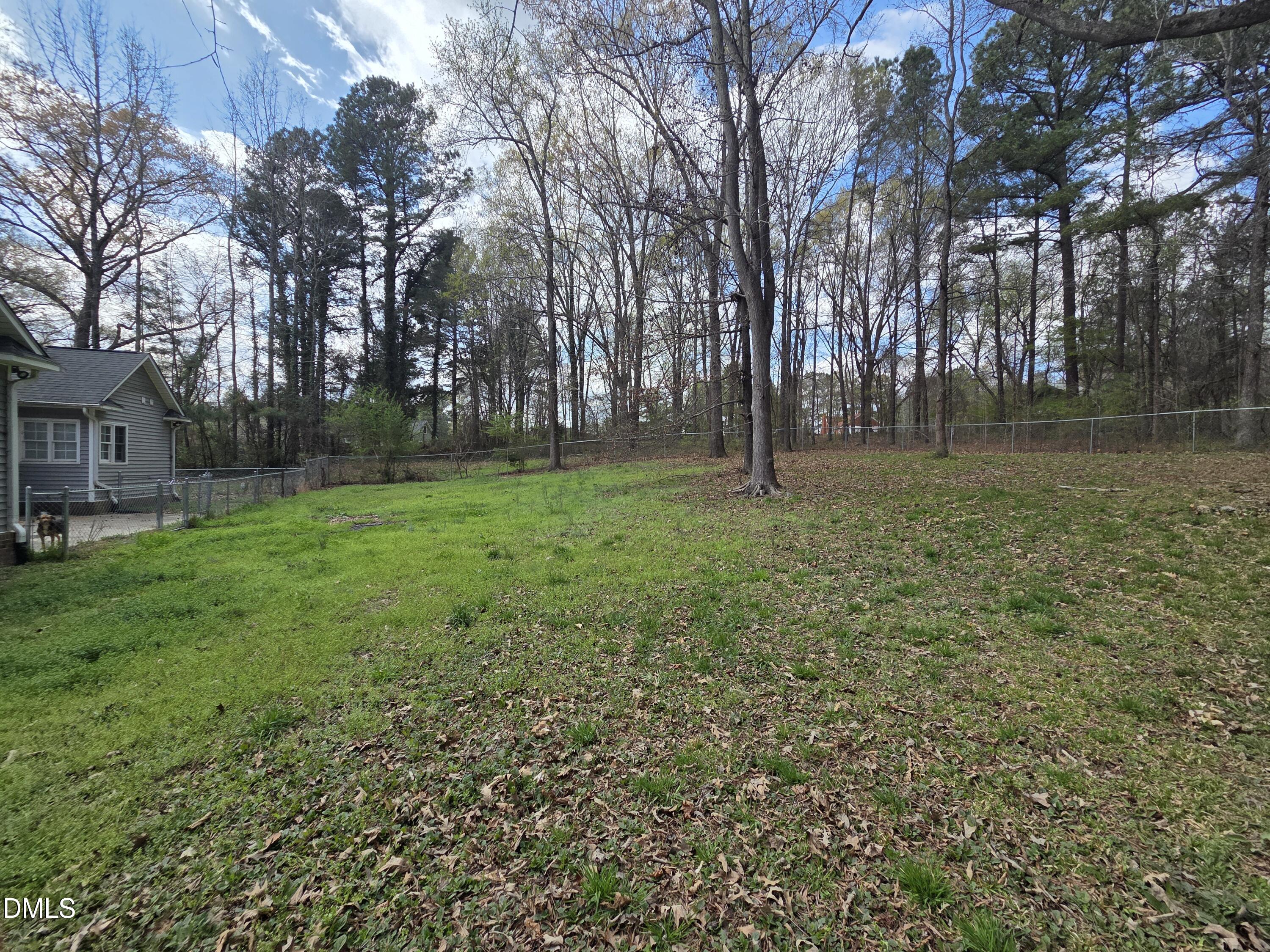 3001 Hidden Spring Lane Oxford, NC 27565 - Photo 7 of 57 a backyard of apartments with large trees