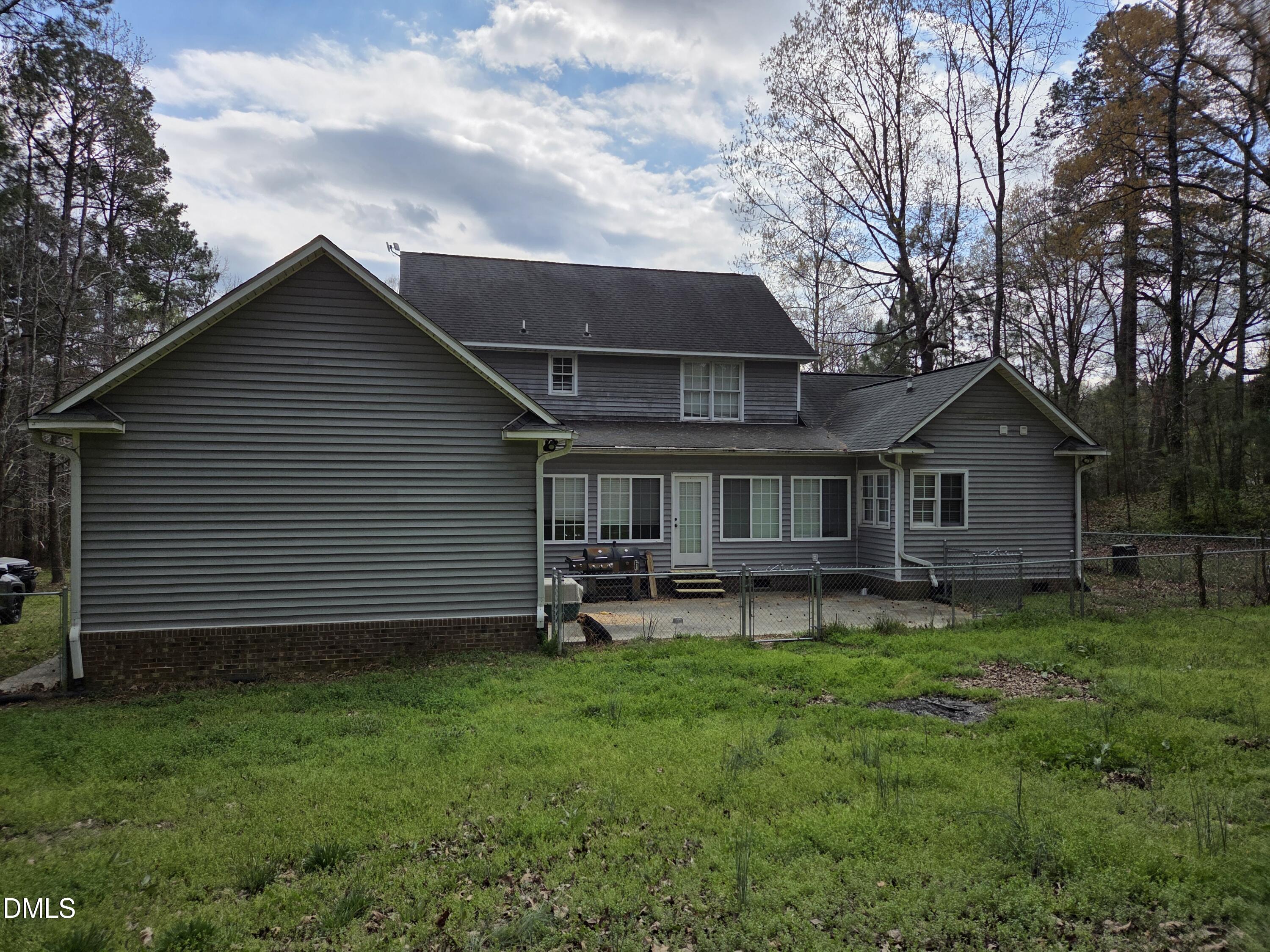 3001 Hidden Spring Lane Oxford, NC 27565 - Photo 10 of 57 a view of a house with a yard and sitting area