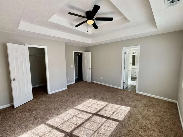 a view of livingroom with hardwood floor and a ceiling fan