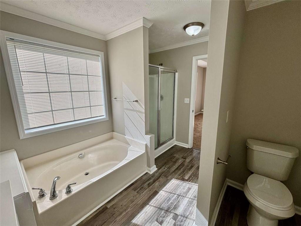 275 Thorn Brook Circle Bethlehem, GA 30620 - Photo 16 of 32 a bathroom with a tub toilet and sink