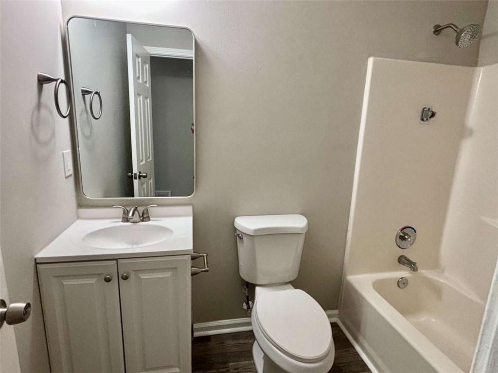 275 Thorn Brook Circle Bethlehem, GA 30620 - Photo 25 of 32 a bathroom with a sink a toilet and shower