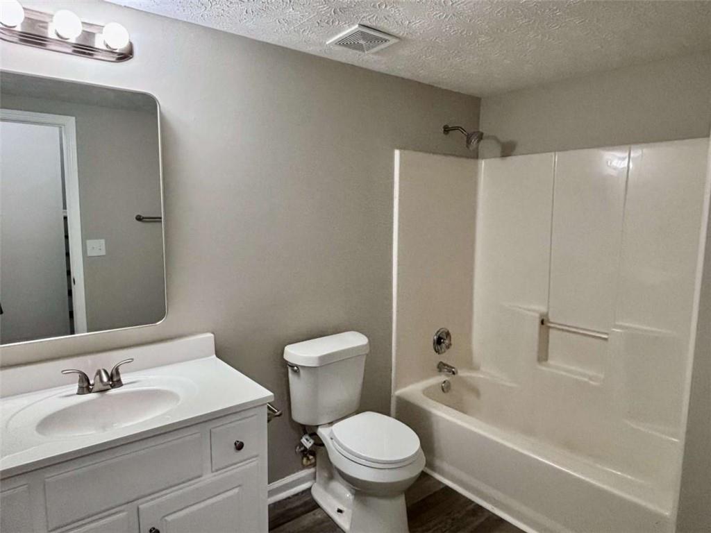 275 Thorn Brook Circle Bethlehem, GA 30620 - Photo 26 of 32 a bathroom with a sink toilet and shower