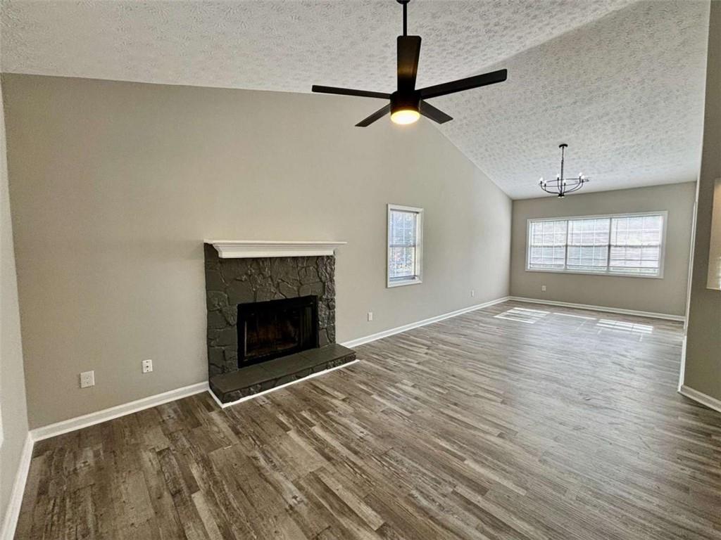 275 Thorn Brook Circle Bethlehem, GA 30620 - Photo 4 of 32 an empty room with windows and fireplace