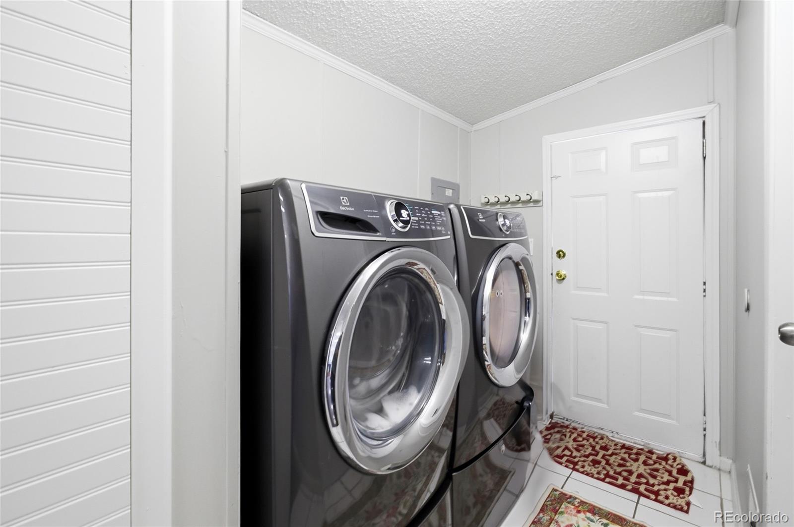 1724 Clark Street Aurora, CO 80011 - Photo 19 of 19 a view of bathroom with washer and dryer