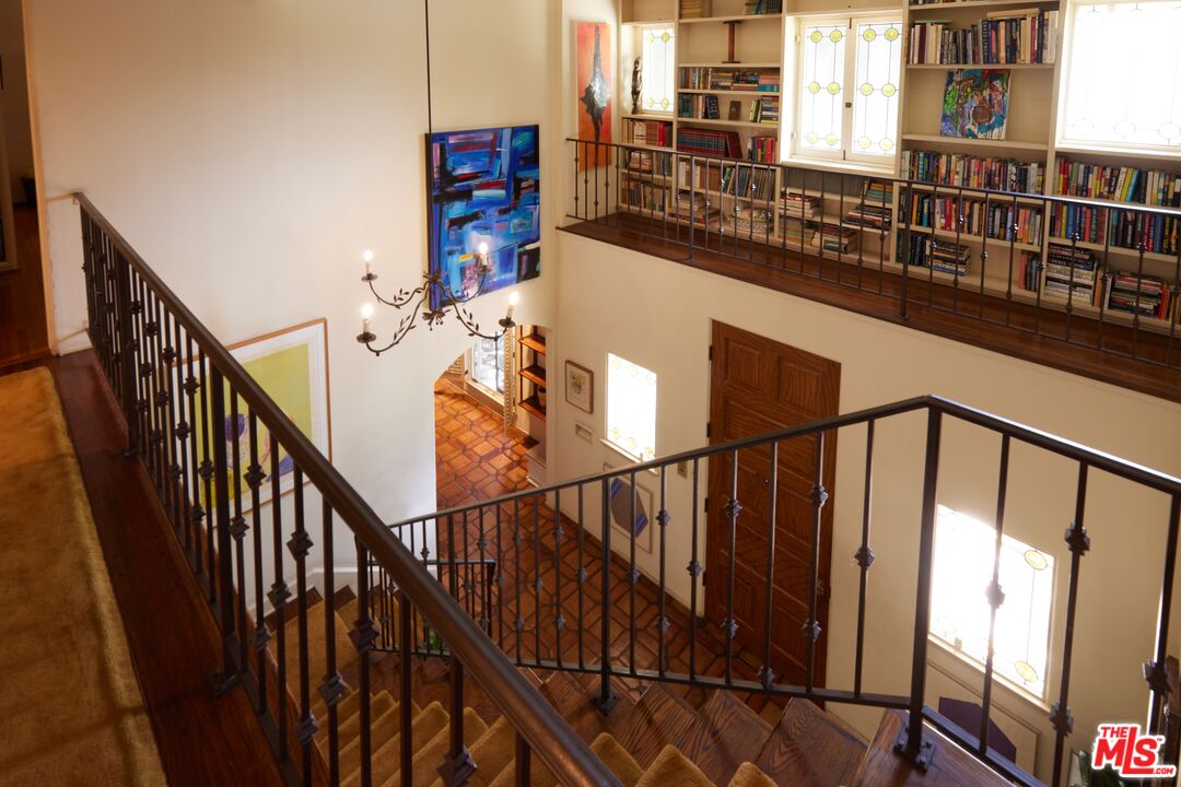 623 North Hillcrest Road Beverly Hills, CA 90210 - Photo 13 of 24 a view of staircase with railing and white walls