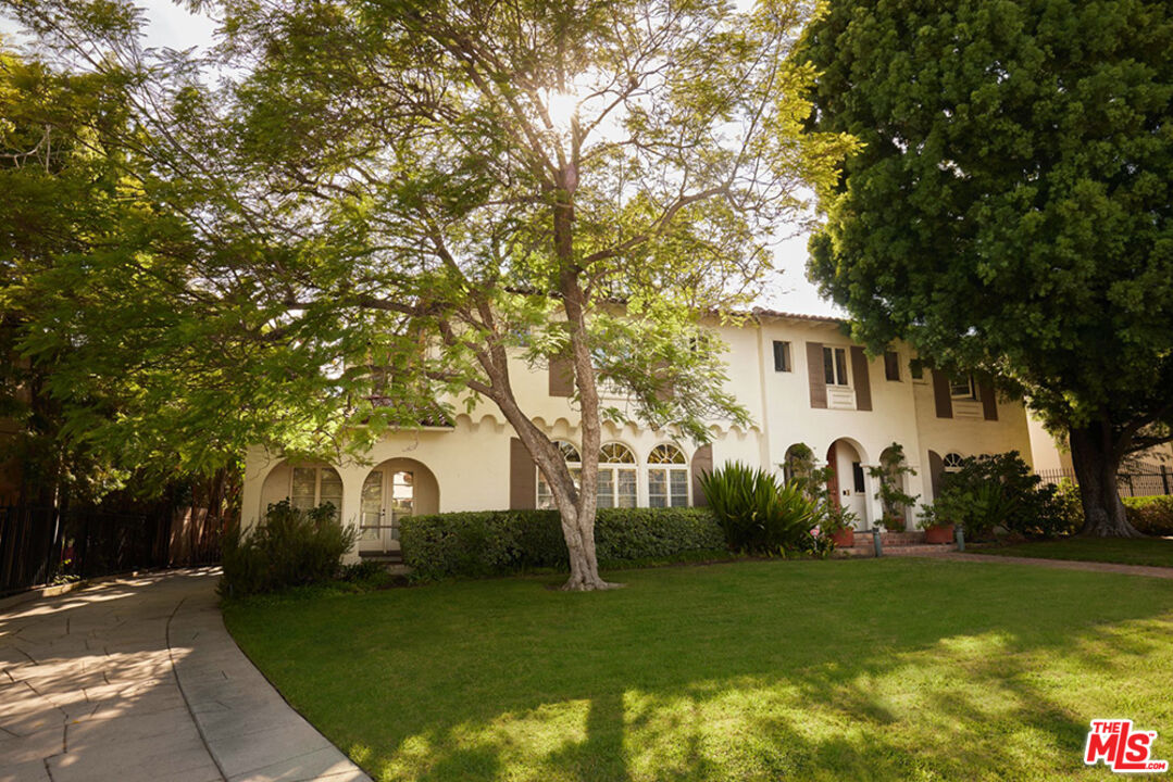 623 North Hillcrest Road Beverly Hills, CA 90210 - Photo 2 of 24 a front view of a house with garden