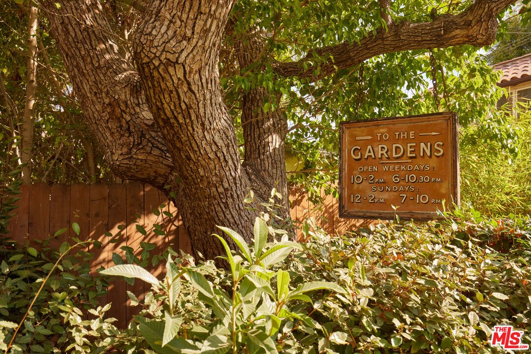 623 North Hillcrest Road Beverly Hills, CA 90210 - Photo 21 of 24 a sign that is sitting in front of a tree