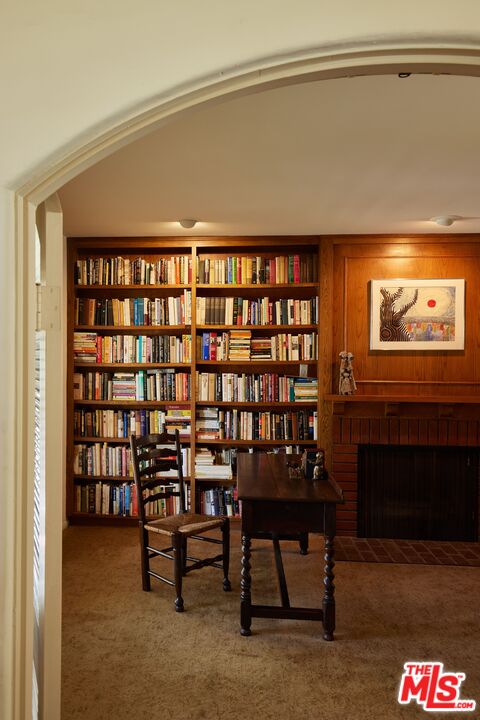 623 North Hillcrest Road Beverly Hills, CA 90210 - Photo 7 of 24 a reading room with furniture and a potted plant