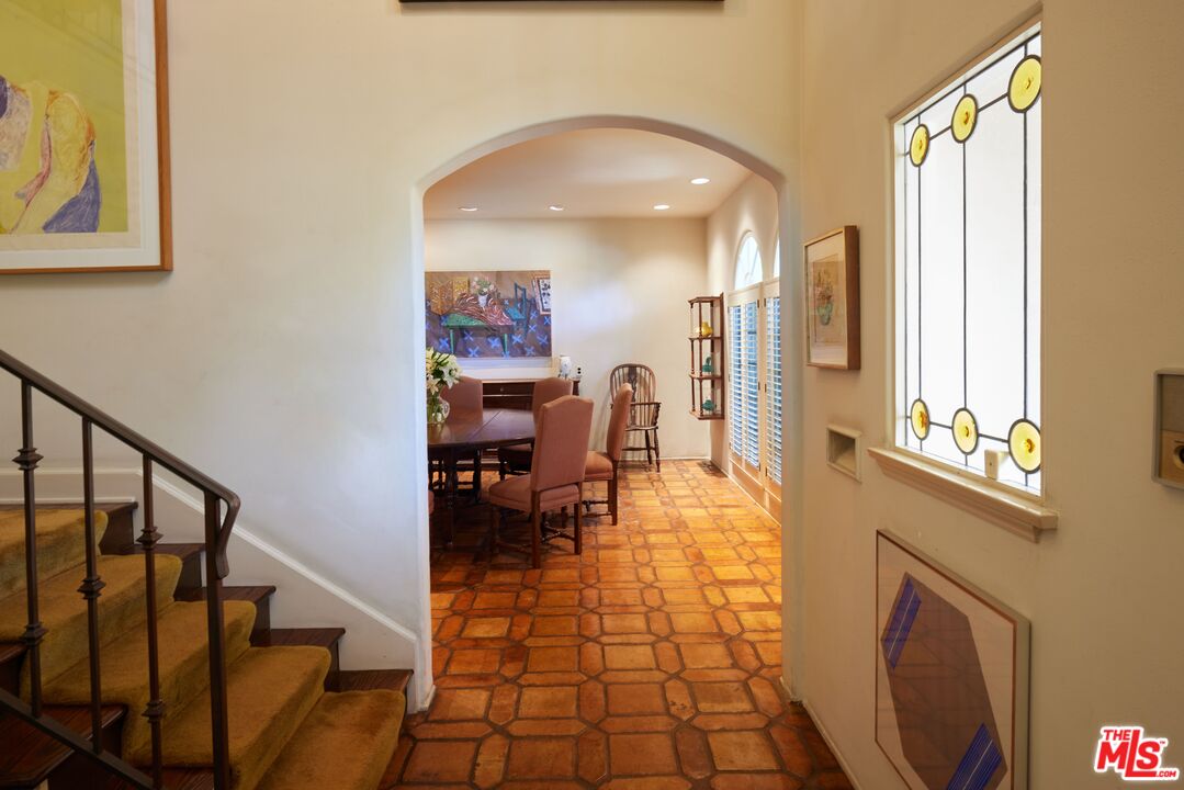 623 North Hillcrest Road Beverly Hills, CA 90210 - Photo 9 of 24 a living room with furniture and a fireplace