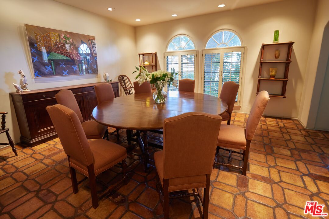 623 North Hillcrest Road Beverly Hills, CA 90210 - Photo 10 of 24 a view of a dining room with furniture