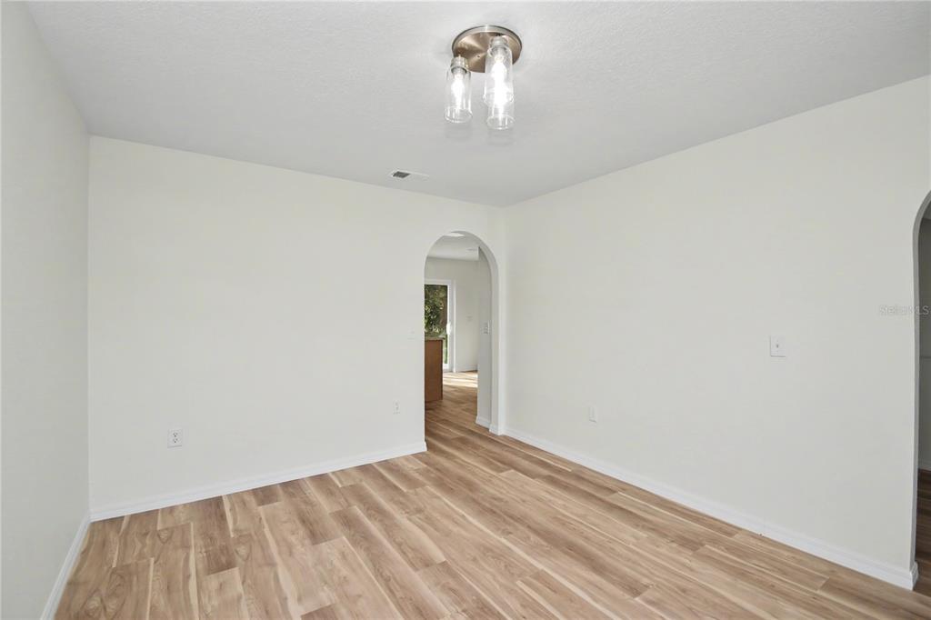 4948 Cromey Road North Port, FL 34288 - Photo 6 of 30 a view of empty room with wooden floor
