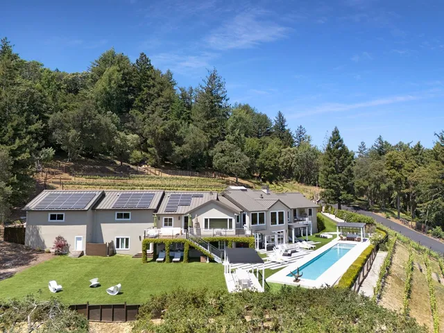 a aerial view of a house with a big yard