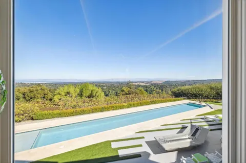 an aerial view of residential house and green space