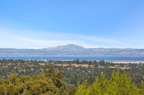 a spacious bedroom with a large bed and a fireplace
